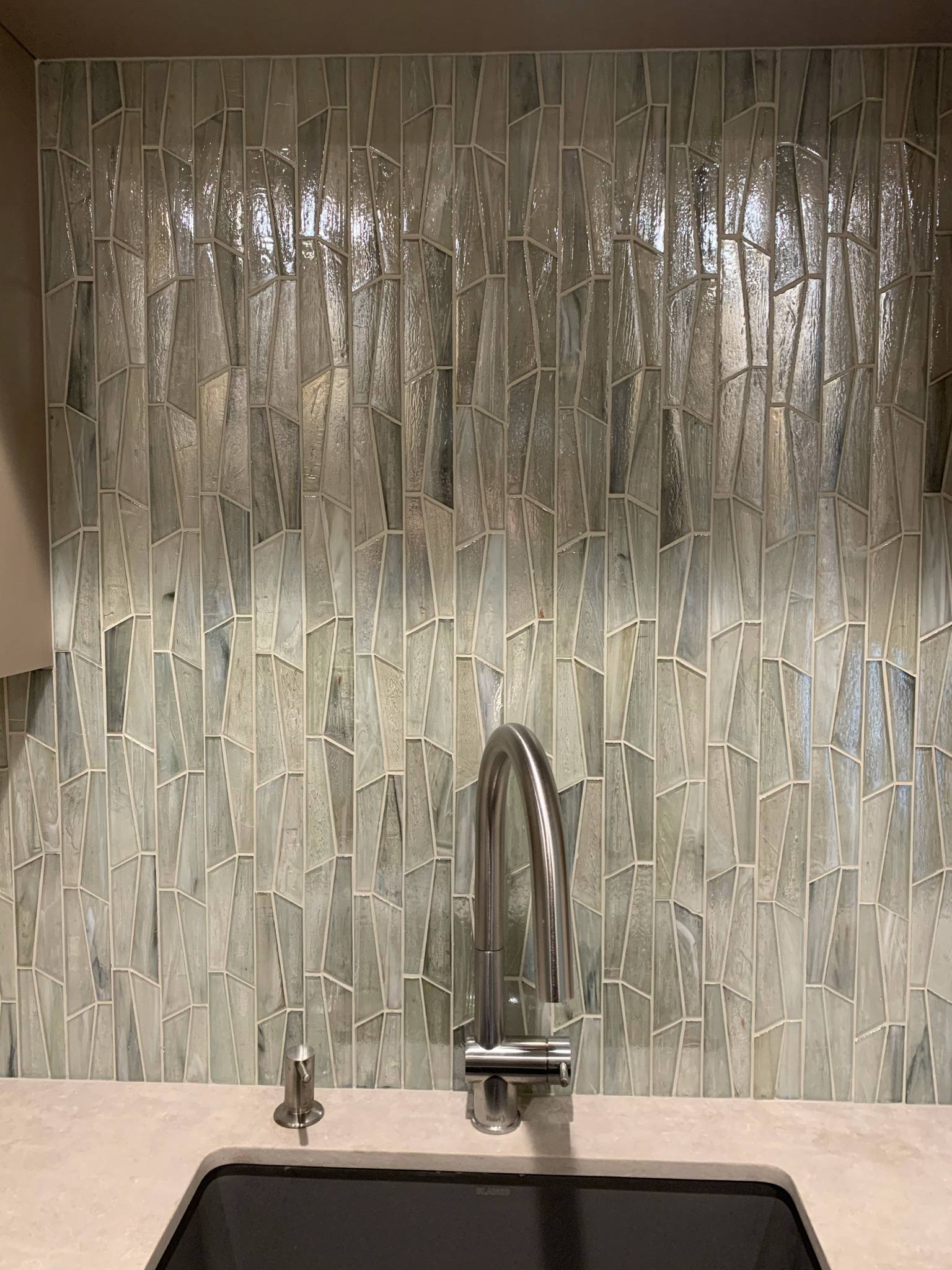 This backsplash is very unique. The earth-toned tiles are set in a bamboo pattern.