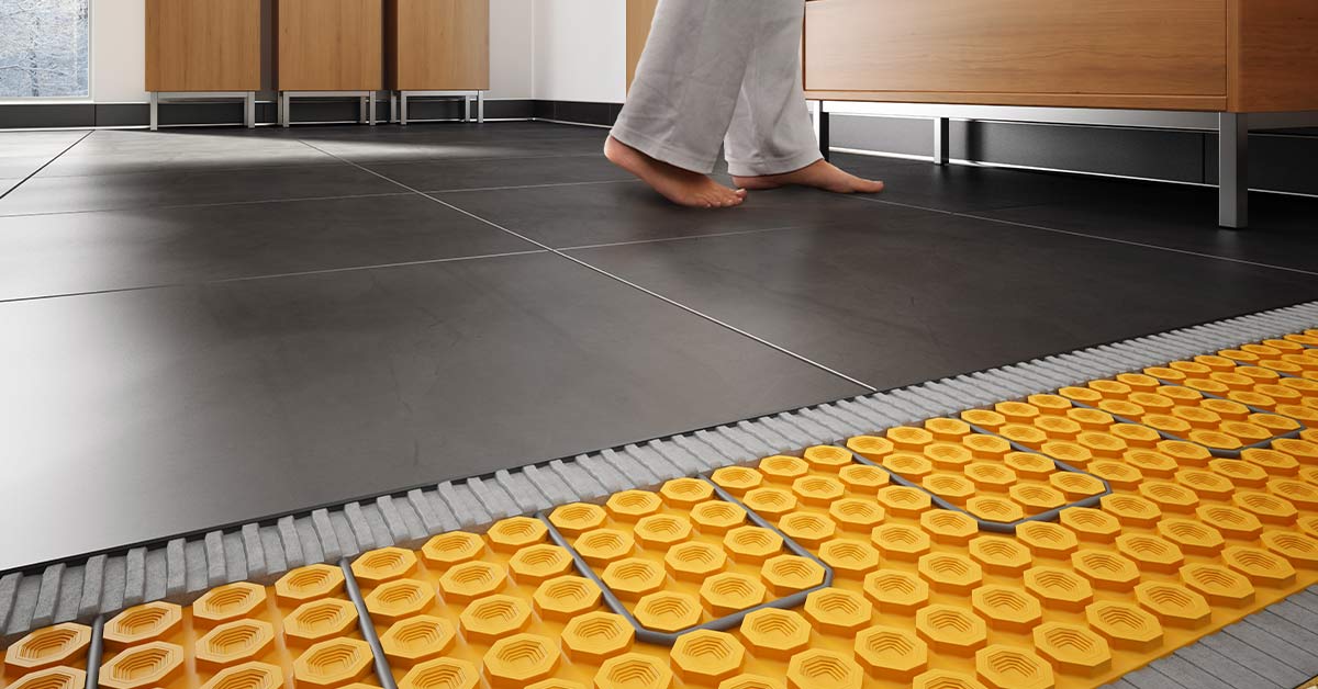 Woman walks on a heated tile floor. The bottom portion of the image shows the Schluter®-DITRA-HEAT system.