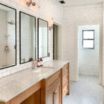 Large bathroom with white subway wall tile and small hexagon floor tile