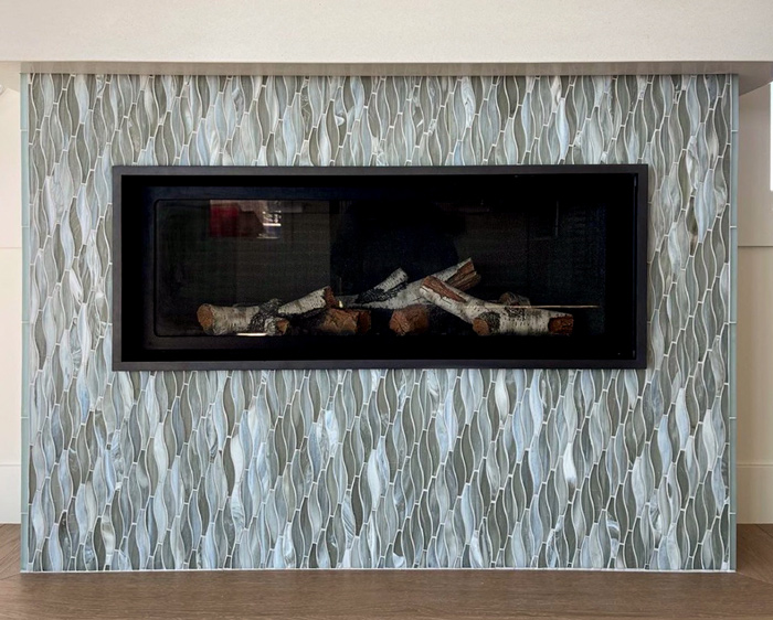 Tile fireplace surround with wavy mosaic
