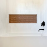Custom Shower over Tub with Oblong Wall Tile and Circular Tile Niche