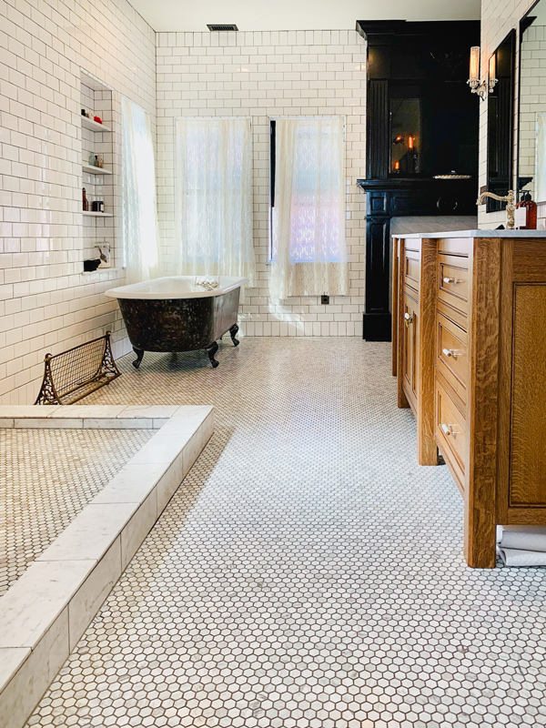 Bathroom with Hexagon shaped floor tile and subway tile walls