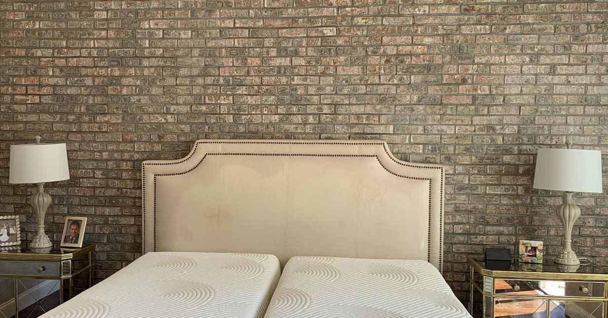 Thin brick tile accent wall in a master bedroom.